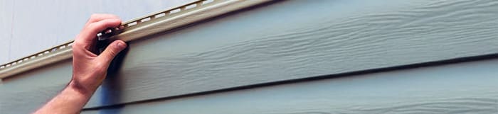 experienced contractor installs vinyl siding plastic panels