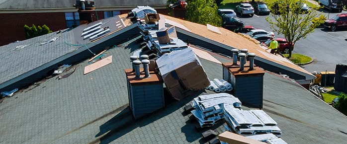 Construction worker on renovation roof the house installed new shingles